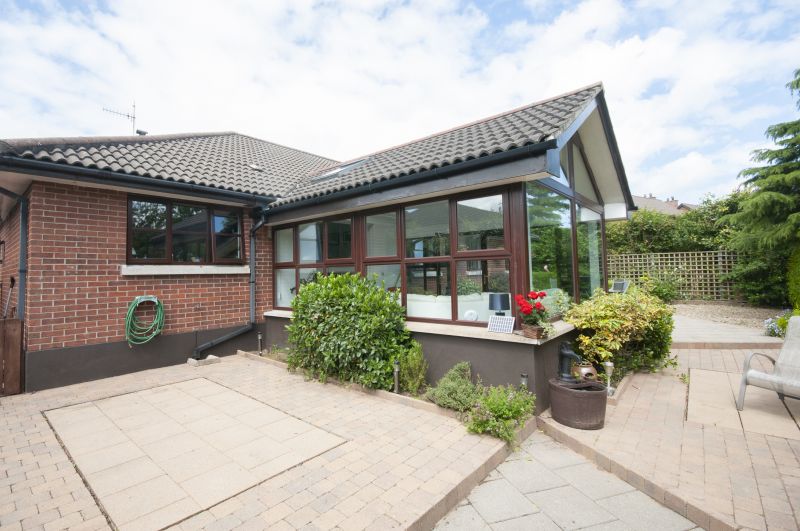 Completed sunroom with outdoor scenery